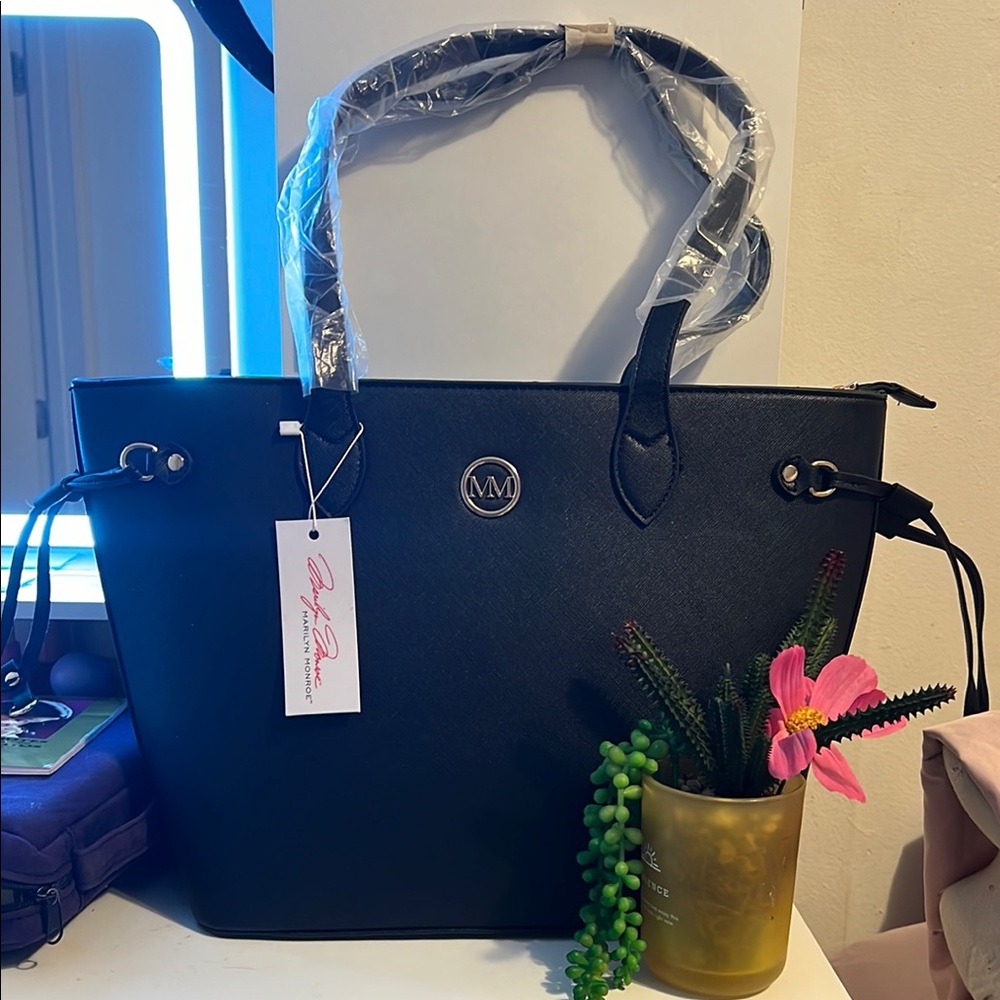 Black Structured Shoulder Bag with Metallic Emblem